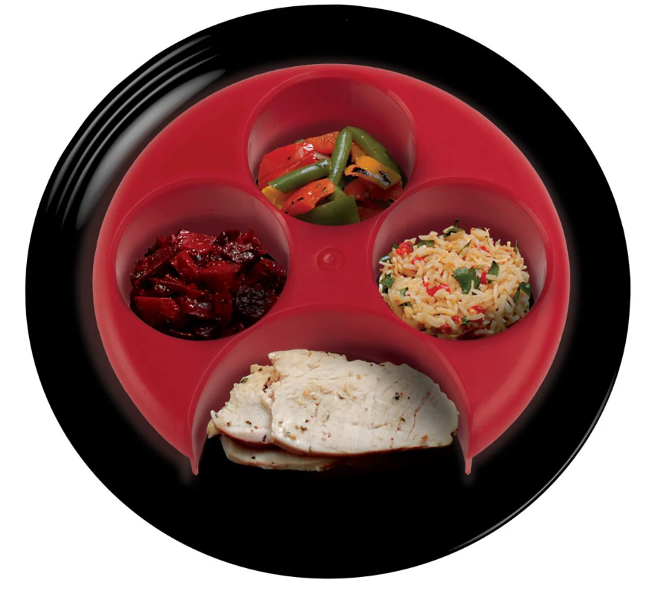 A meal measurer filled with healthy foods.